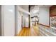 Bright hallway featuring hardwood floors and access to a well-lit, open-concept living space, showcasing modern design at 1510 Wazee St # 3, Denver, CO 80202