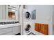 Bathroom featuring stacked washer and dryer, vanity, and modern finishes at 1510 Wazee St # 3, Denver, CO 80202