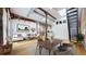 Open living room boasting exposed brick, high ceilings, and modern furnishings at 1510 Wazee St # 3, Denver, CO 80202