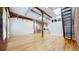 Inviting living area with hardwood floors, open layout, and exposed brick, blending modern and rustic elements seamlessly at 1510 Wazee St # 3, Denver, CO 80202
