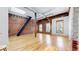 Spacious room showcasing brick accents, modern lighting, and hardwood floors, creating a stylish, urban ambiance at 1510 Wazee St # 3, Denver, CO 80202
