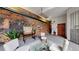 Inviting lobby with exposed brick wall, modern furnishings, and comfortable seating arrangement at 1510 Wazee St # 3, Denver, CO 80202
