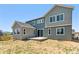 Exterior of the house features a backyard and patio, perfect for outdoor relaxation and entertainment at 1714 Morgan Dr, Erie, CO 80516