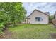 Well-maintained backyard with a grassy lawn, a wooden deck, and privacy fencing at 2307 S Ensenada St, Aurora, CO 80013