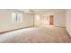 Spacious carpeted basement providing versatile extra living space with natural light at 2307 S Ensenada St, Aurora, CO 80013