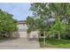 Charming home featuring a three-car garage and mature trees in a well-maintained neighborhood at 2307 S Ensenada St, Aurora, CO 80013