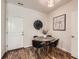 Breakfast nook with a round table and four chairs, neutral walls and wood-look floors at 504 E Dry Creek Pl, Littleton, CO 80122