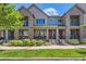 Attractive brick and siding townhome with landscaped yard and inviting front porches in a desirable neighborhood at 504 E Dry Creek Pl, Littleton, CO 80122