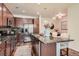 Spacious kitchen features stainless steel appliances, granite counters, breakfast bar and ample cabinetry at 504 E Dry Creek Pl, Littleton, CO 80122