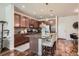 Stylish kitchen with granite countertops, stainless steel appliances, and ample cabinet space for modern living at 504 E Dry Creek Pl, Littleton, CO 80122