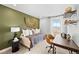 Comfortable bedroom with a daybed, desk, and modern decor, perfect for work or relaxation at 17117 W 91St Ln, Arvada, CO 80007