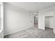 Spacious bedroom featuring neutral carpet and entry doors at 17117 W 91St Ln, Arvada, CO 80007