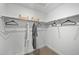Walk-in closet features rod and shelf storage for ample clothing storage at 17117 W 91St Ln, Arvada, CO 80007