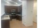 Modern kitchen features stainless steel appliances, dark cabinets, and light countertops at 17117 W 91St Ln, Arvada, CO 80007