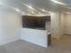 Open concept kitchen has dark wood cabinets, stainless appliances, and eat-in bar at 17117 W 91St Ln, Arvada, CO 80007