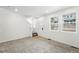 Bright and airy living room with a view of the front door and windows at 17117 W 91St Ln, Arvada, CO 80007