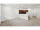 Spacious living room showcasing an open floor plan with the kitchen in the background at 17117 W 91St Ln, Arvada, CO 80007