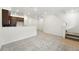 Spacious living room features plush carpeting and white walls at 17117 W 91St Ln, Arvada, CO 80007