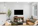 Cozy living room with comfortable seating, a stylish media console, and neutral decor at 17117 W 91St Ln, Arvada, CO 80007