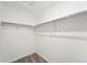 Walk-in closet with neutral carpet and closet rod at 17117 W 91St Ln, Arvada, CO 80007