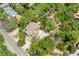 Aerial view of a home nestled among mature trees, showing the property's layout and landscaping at 740 Carr St, Lakewood, CO 80214