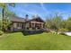 Charming home with a well-maintained lawn, stone porch, and mature trees in a peaceful setting at 740 Carr St, Lakewood, CO 80214