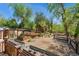 Expansive backyard featuring gardens, walking path and an outbuilding creating a serene outdoor space at 740 Carr St, Lakewood, CO 80214