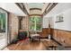 Cozy room with a wood-burning stove, decorative wall tiles, and bright window, creating a relaxing ambiance at 740 Carr St, Lakewood, CO 80214