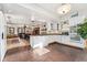 Open concept kitchen features white cabinetry, granite countertops, eat-in area, and stone tile floors at 740 Carr St, Lakewood, CO 80214