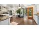 Bright kitchen with a double oven, granite countertops, tile floors, and access to a balcony at 740 Carr St, Lakewood, CO 80214
