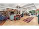 Spacious living room with a stone fireplace, hardwood floors, and an open floor plan at 740 Carr St, Lakewood, CO 80214
