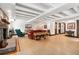 Spacious living room with fireplace, wood floors, and beamed ceiling at 740 Carr St, Lakewood, CO 80214