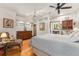 Stylish main bedroom with hardwood floors, a ceiling fan, neutral paint and decorative touches at 740 Carr St, Lakewood, CO 80214