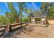 Quaint outbuilding surrounded by lush greenery and a rustic fence, offering a private retreat at 740 Carr St, Lakewood, CO 80214