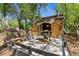 Exterior view of an outbuilding featuring large open doors and a workspace at 740 Carr St, Lakewood, CO 80214