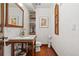 Powder room featuring a vessel sink, wood floors, accent lighting and decor at 740 Carr St, Lakewood, CO 80214