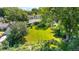 Aerial view of property showcasing large lot with manicured lawn, mature trees, and lush landscaping at 1315 Tipperary St, Boulder, CO 80303
