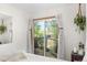 Bedroom sliding glass door opening to a private deck, featuring peaceful outdoor views at 1315 Tipperary St, Boulder, CO 80303