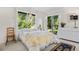 Bright and airy bedroom featuring large windows, natural light, and a comfortable bed at 1315 Tipperary St, Boulder, CO 80303