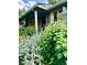 This beautiful home features lush landscaping and a charming covered porch entrance at 1315 Tipperary St, Boulder, CO 80303