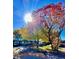 Traditional single-story home with mature trees and a well-maintained front yard under a sunny sky at 1315 Tipperary St, Boulder, CO 80303