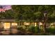 Charming home exterior at twilight, showcasing lush landscaping and a welcoming entrance at 1315 Tipperary St, Boulder, CO 80303