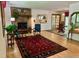 Inviting living room featuring a brick fireplace and an open layout, ideal for entertaining at 1315 Tipperary St, Boulder, CO 80303