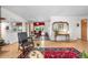 Open concept living room with dining area and hardwood floors, bright with natural light at 1315 Tipperary St, Boulder, CO 80303