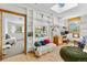 Bright office featuring built-in shelves, a desk, and plenty of natural light from the windows at 1315 Tipperary St, Boulder, CO 80303