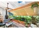 Inviting sunroom with skylights, a wood-burning stove, and windows with plants and lots of light at 1315 Tipperary St, Boulder, CO 80303