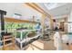 Beautiful sunroom with a wood-burning stove, wood floors, skylights, and walls of windows at 1315 Tipperary St, Boulder, CO 80303