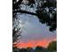Dramatic sunset featuring vibrant colors over the neighborhood and mountain view at 1315 Tipperary St, Boulder, CO 80303
