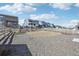 Spacious backyard with gravel landscape, new grass, and secure fencing, perfect for outdoor activities at 8073 Mt Lincoln Rd, Littleton, CO 80125