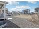 Backyard featuring a gravel landscape, new grass, and secure fencing, offering a private retreat at 8073 Mt Lincoln Rd, Littleton, CO 80125